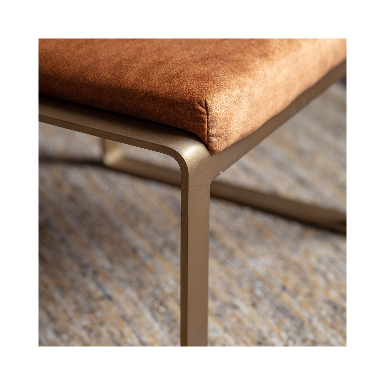 Read more about Small tan leather footstool with gold legs fabien